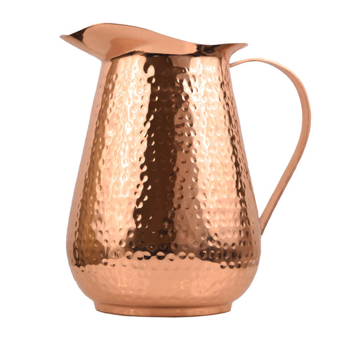 Artisan's Anvil hammered copper pitcher front view with handle for elegant entertaining.