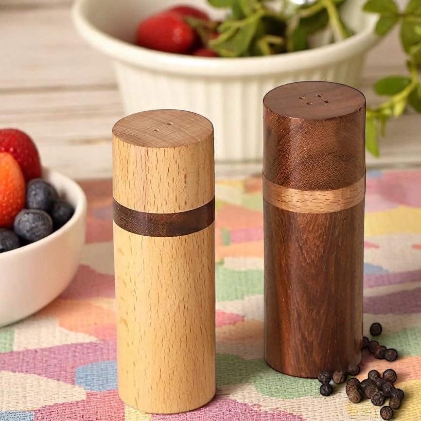 Artistic India rosewood pepper shaker adds rich color and durable performance at table.