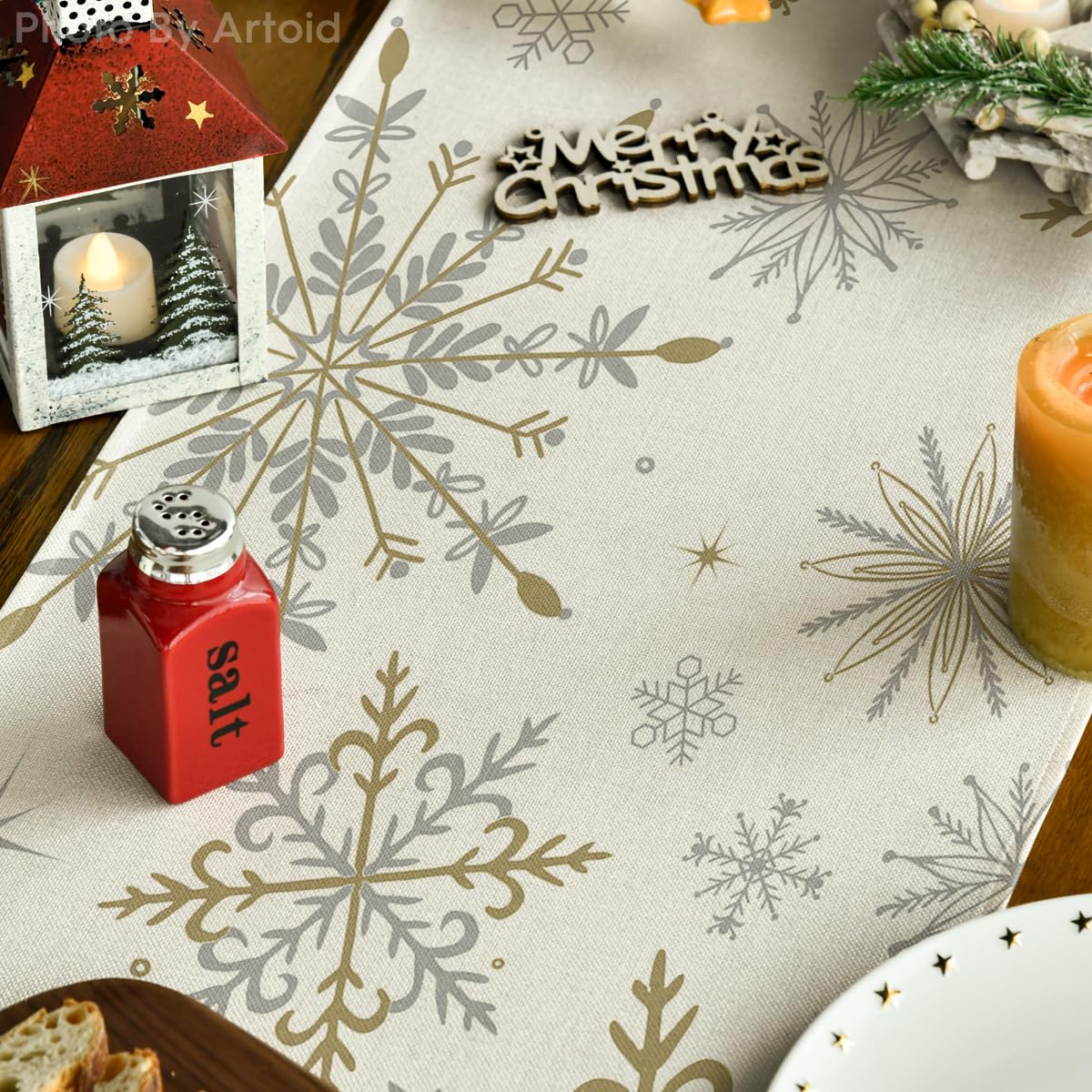 Artoid Mode beige snowflake table runner on holiday dining setup.