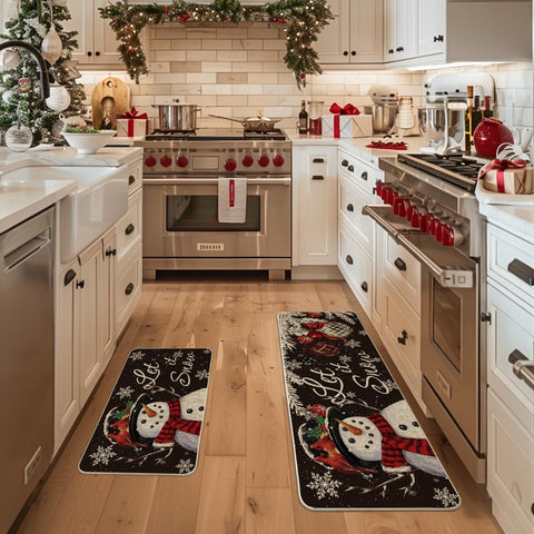 Artoid Mode black snowman kitchen mat 17x47, non-slip back for stable everyday use.