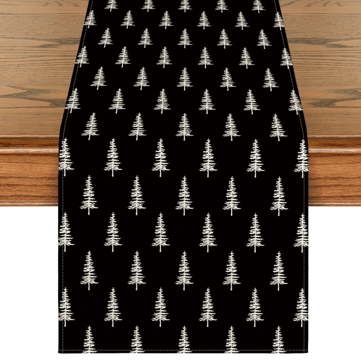 Artoid Mode black Xmas Tree table runner on a dining table for festive ambiance.