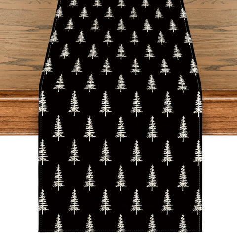Artoid Mode black Xmas Tree table runner on a dining table for festive ambiance.