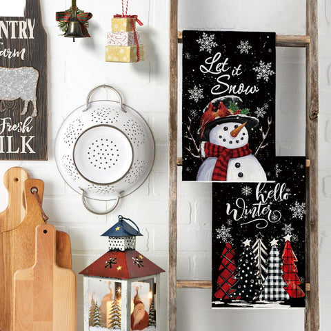 Artoid Mode Christmas decor towels brighten kitchens during routine cleaning.