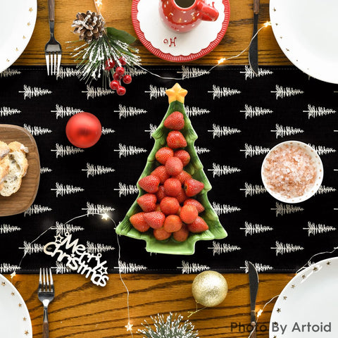 Artoid Mode dining table setup with runner and holiday decor coordination.
