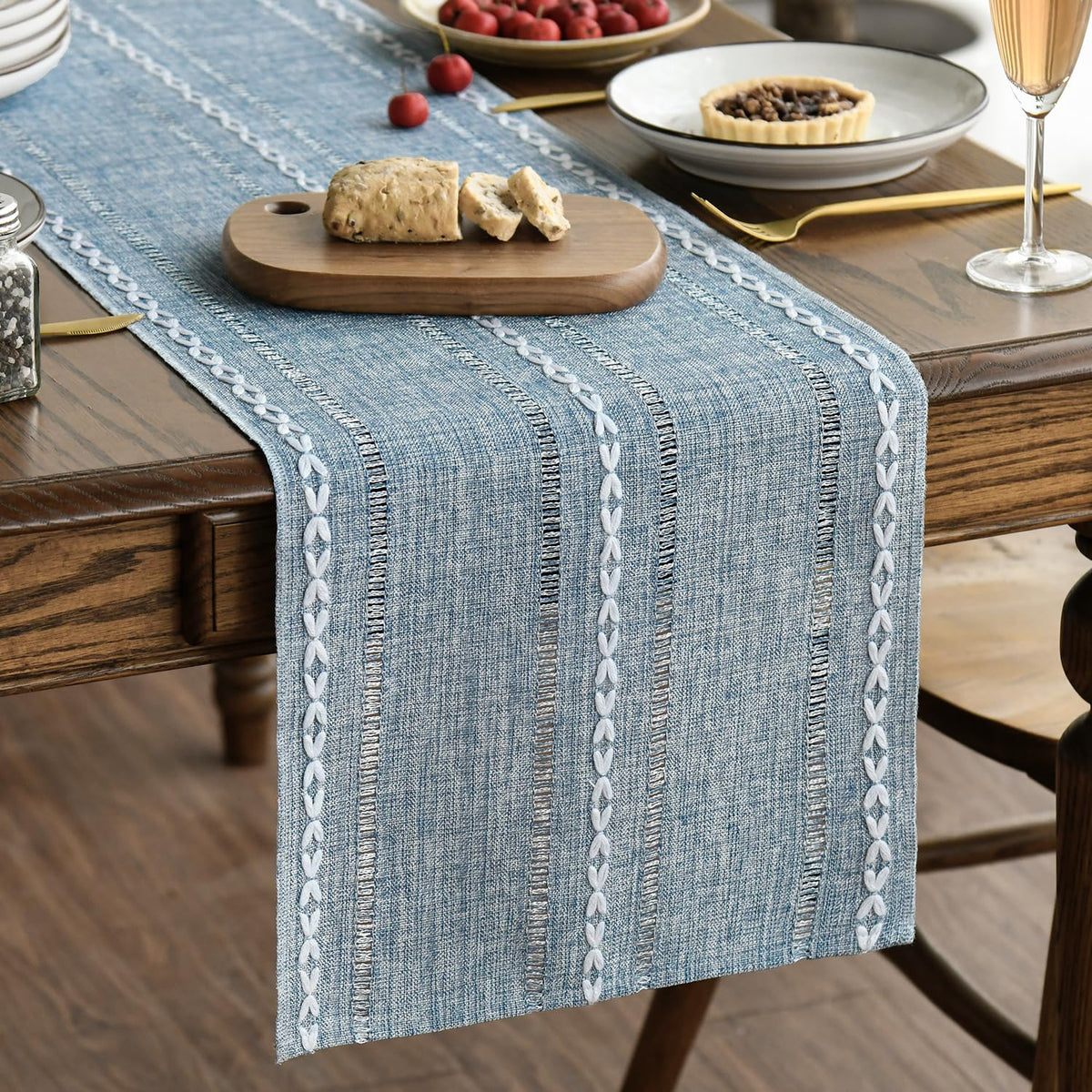 Artoid Mode dusty blue table runner close-up shows embroidery for elegant dining
