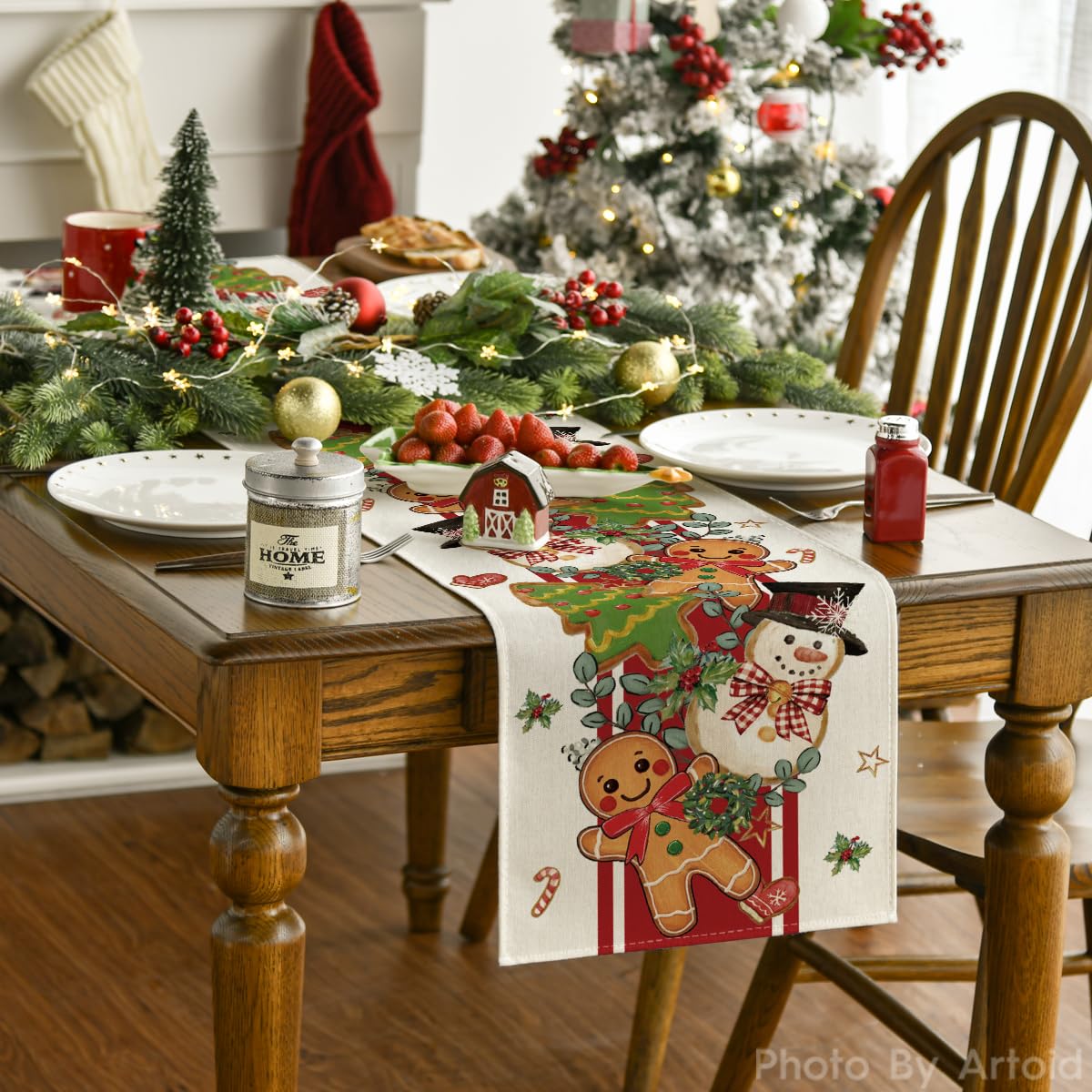 Artoid Mode Gingerbread Snowman table runner on a dining setup for a festive meal