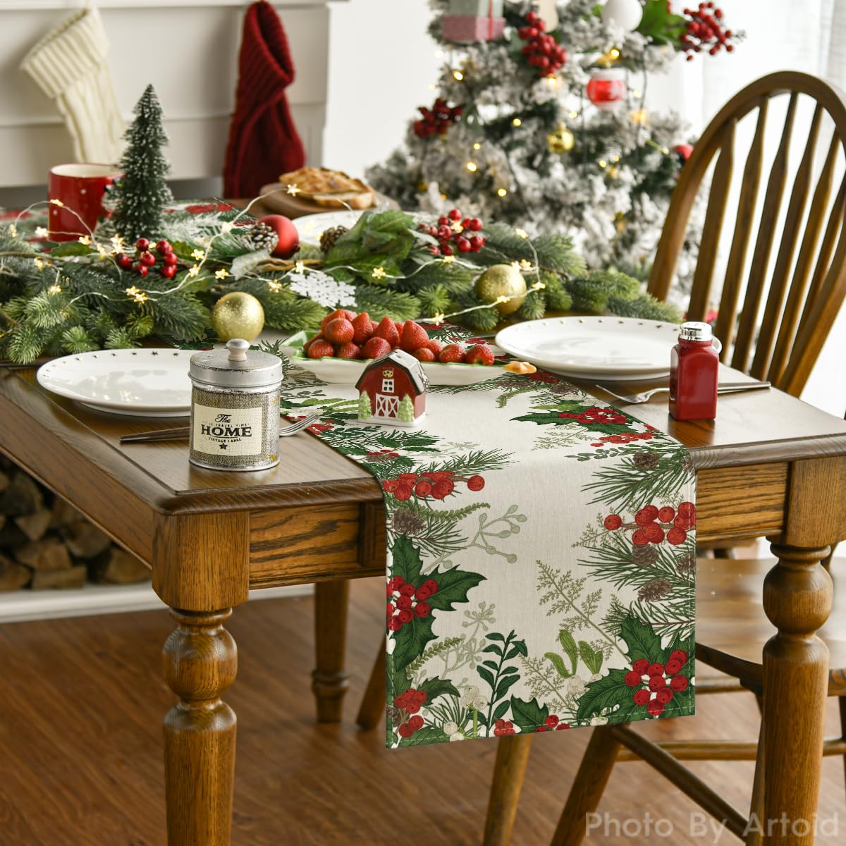 Artoid Mode holly pine cone table runner pattern displayed on a festive table