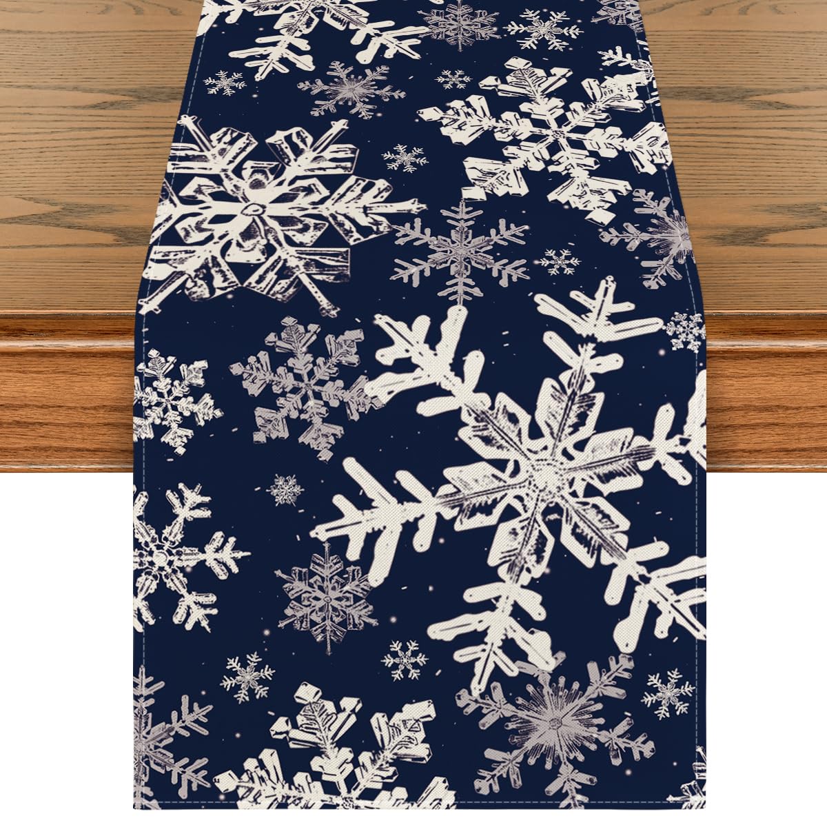 Artoid Mode navy snowflakes table runner protects surfaces with seasonal elegance.