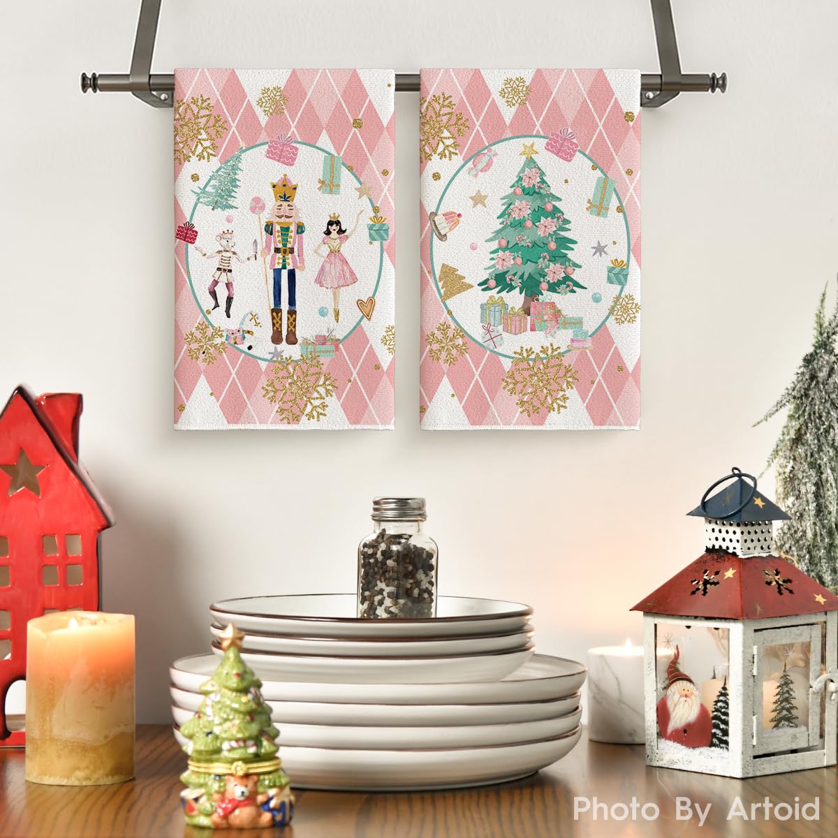 Artoid Mode pink nutcrackers towel pattern close-up highlighting festive kitchen decor.
