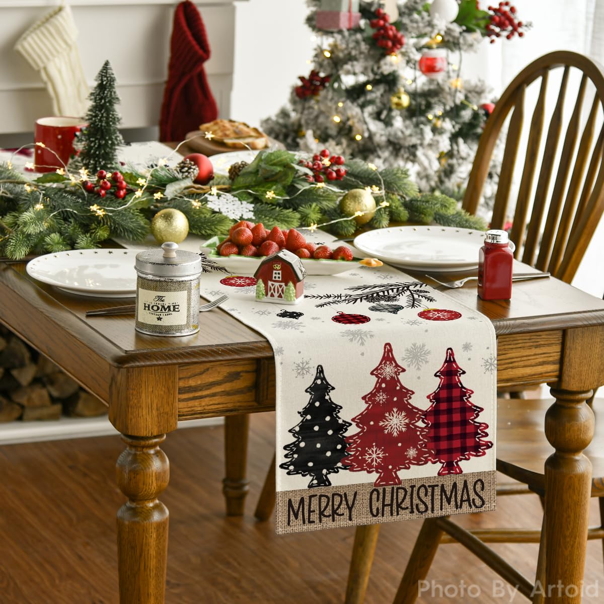 Artoid Mode red pine trees table runner on a dining setup for gatherings.