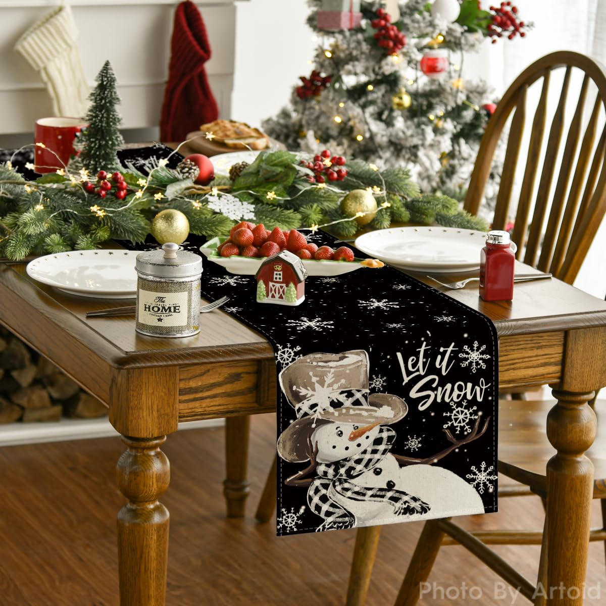 Artoid Mode winter table runner with snowflake motif enhances festive gatherings on a dining table.