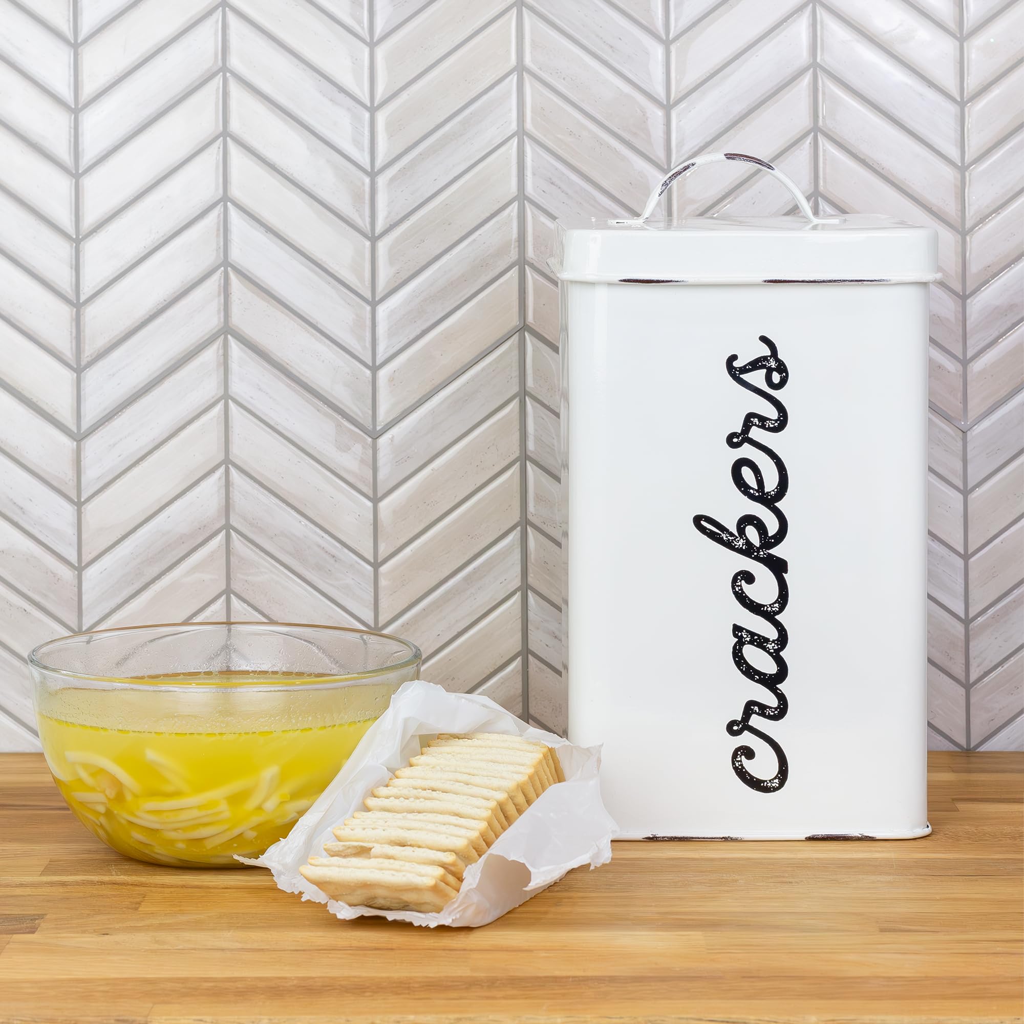 AuldHome enamel cracker canister with black crackers script for decorative pantry storage.