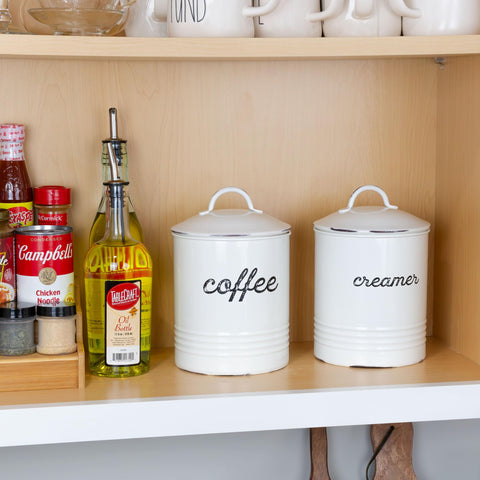 AuldHome enamelware coffee canister distressed texture closeup emphasizes vintage charm.