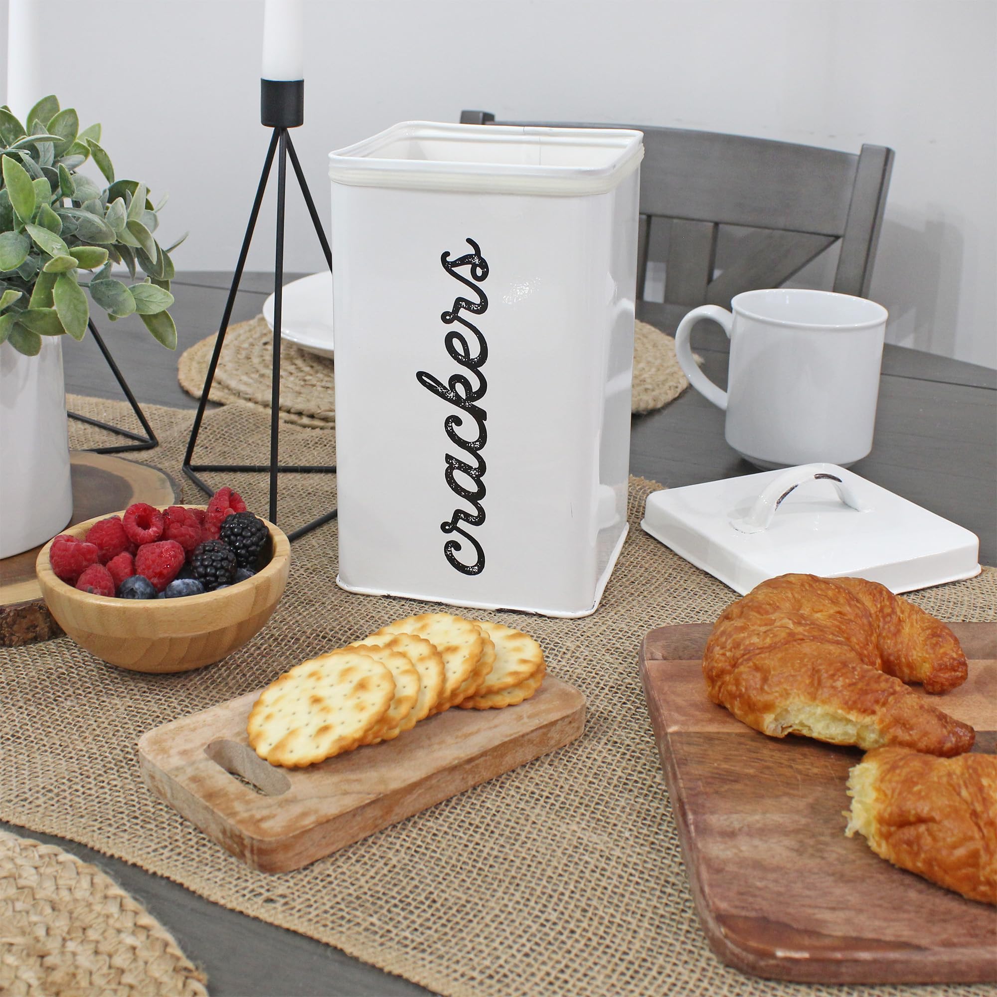 AuldHome white enamelware cracker tin on a counter for organized snacks.