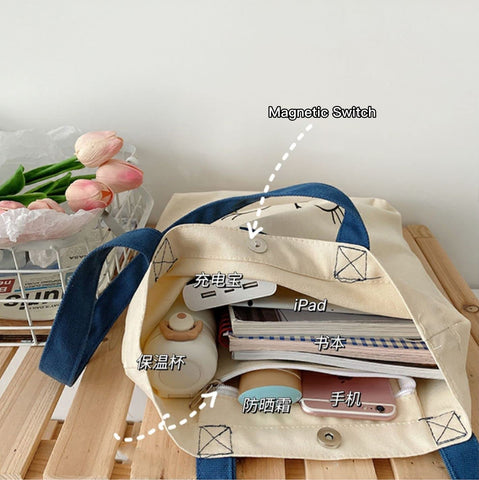 AWXZOM canvas tote bag side view highlights roomy capacity