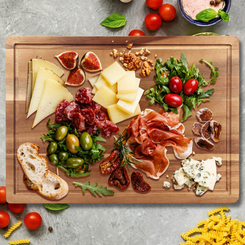 Ayiaren acacia wood cutting board, reversible side visible, catches juices and doubles as charcuterie.