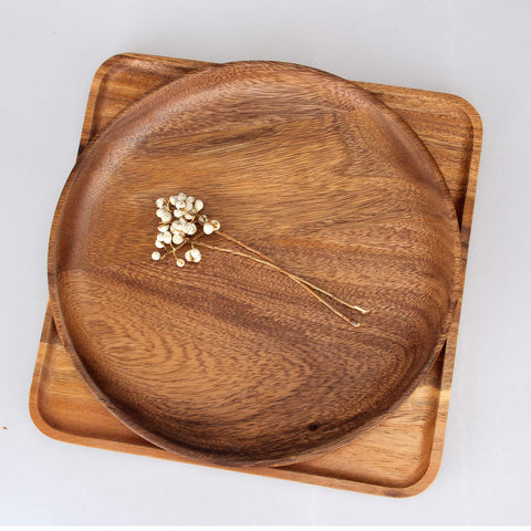 Ayiaren wood serveware on table adds rustic charm