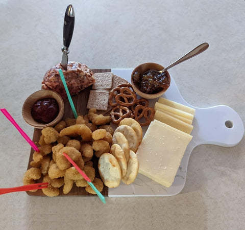 Azauvc cutting board with handle serving tray for easy transport and presentation.