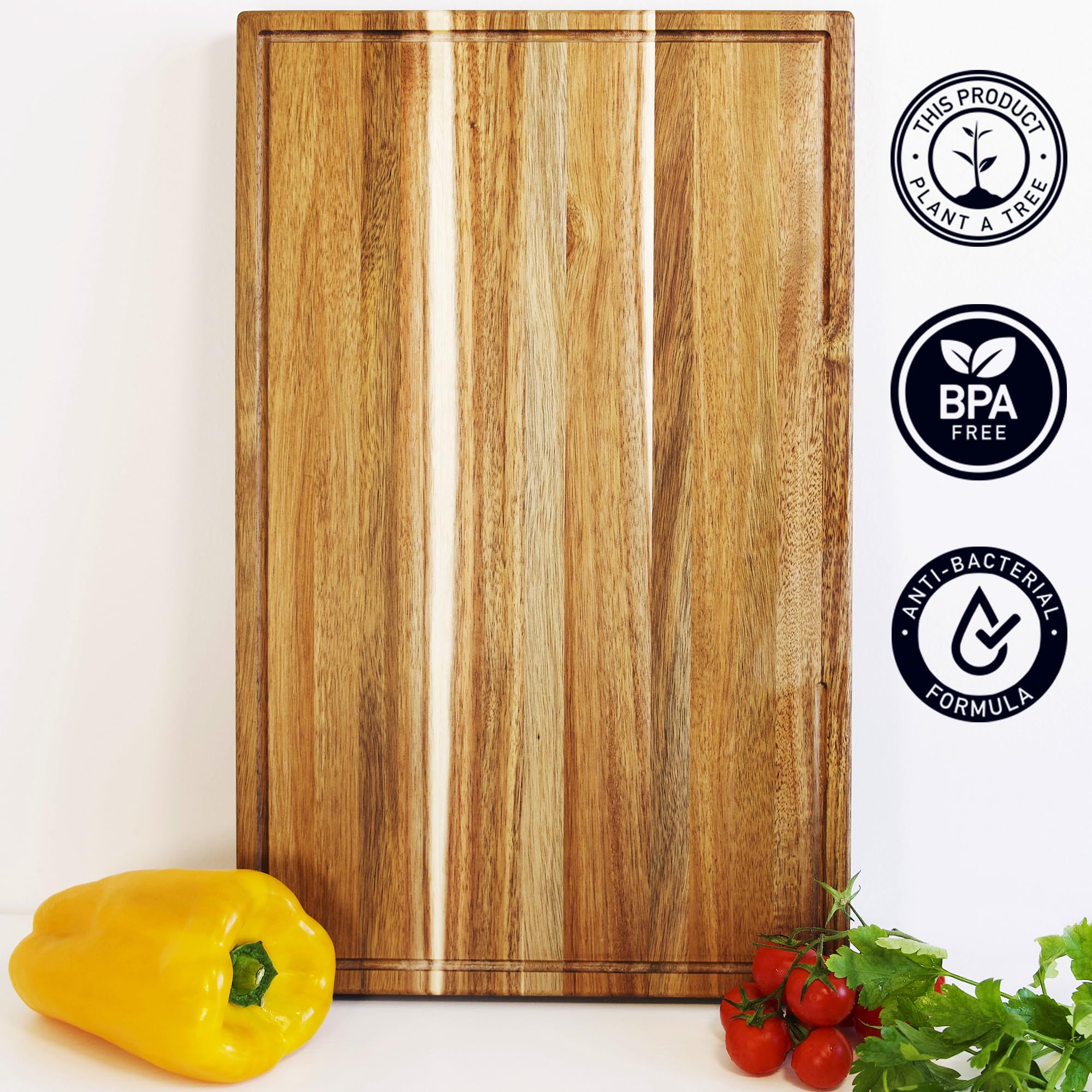 BABILONIA acacia board with notch for sliding chopped produce into pots.