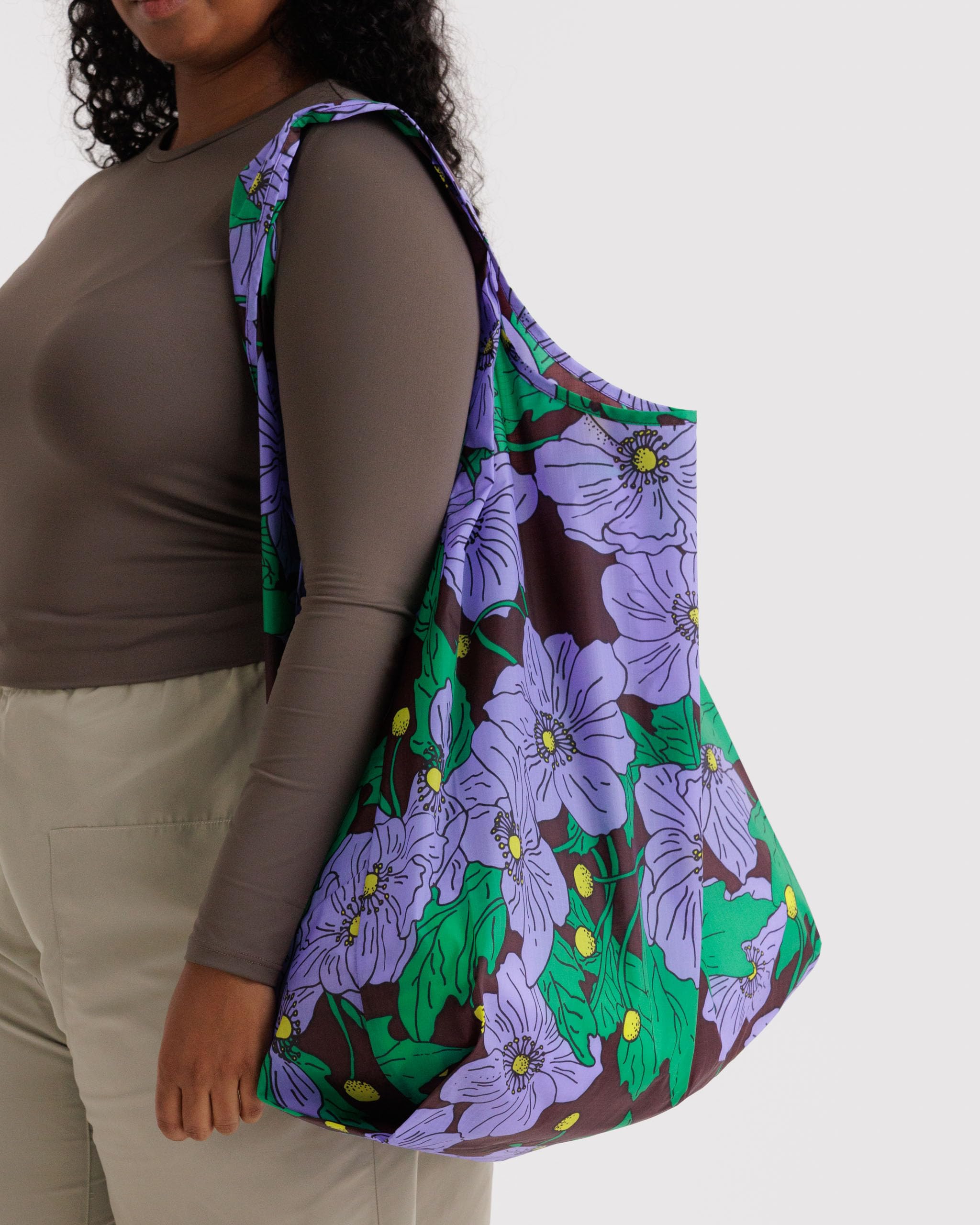 BAGGU Amazon Florals tote folded into the compact pouch for easy packing.