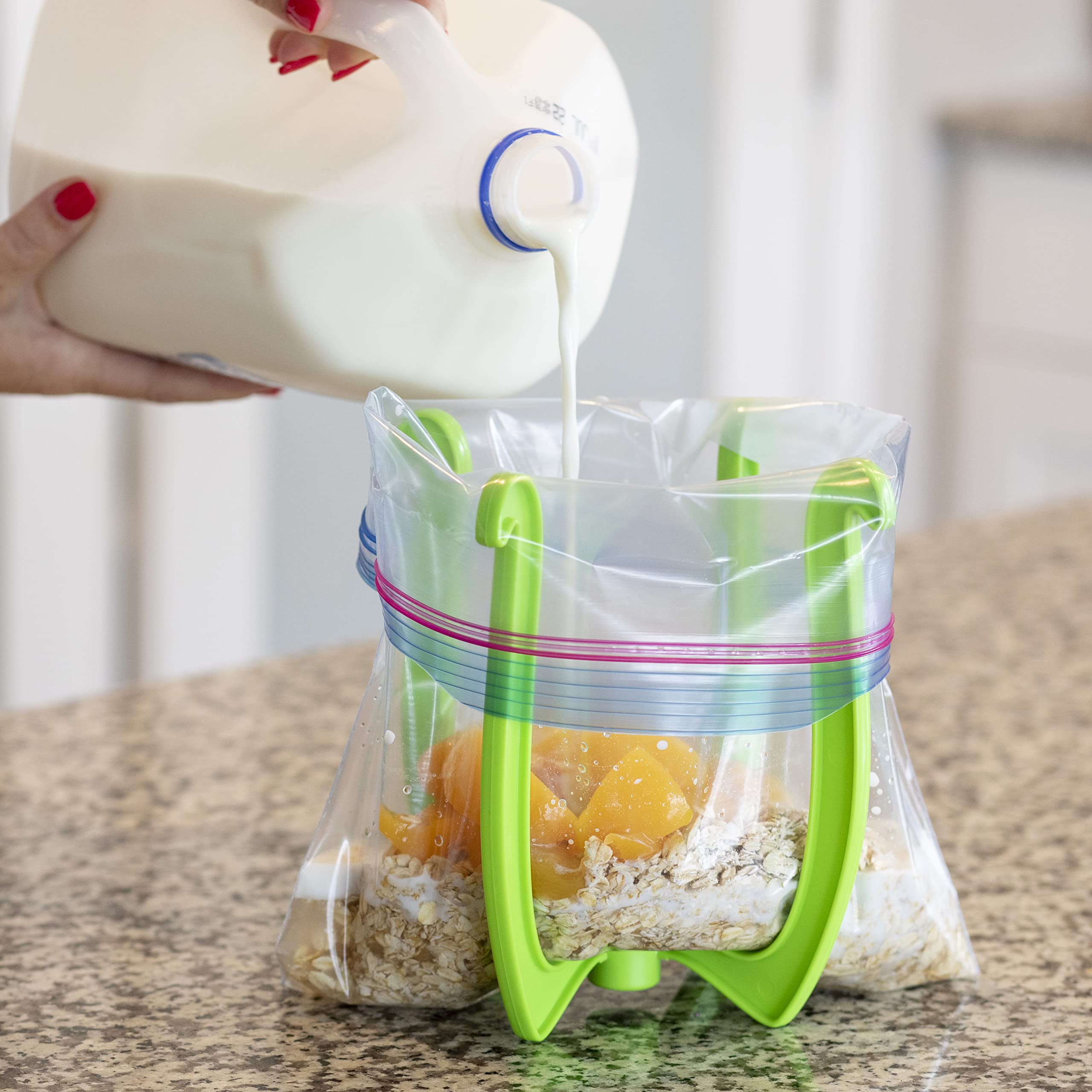 Bagwell bag holder filling leftovers into bags