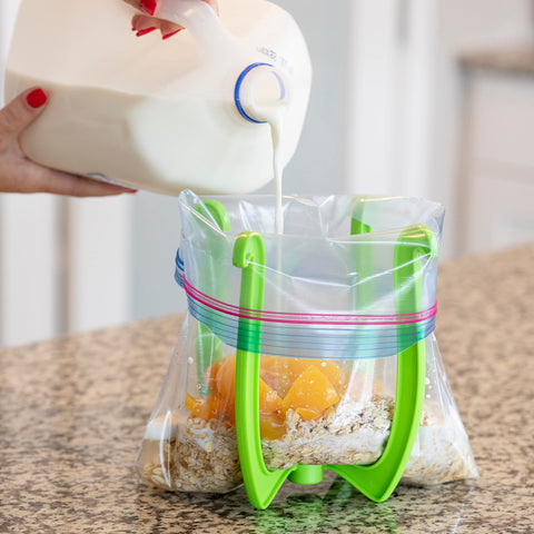 Bagwell bag holder filling leftovers into bags