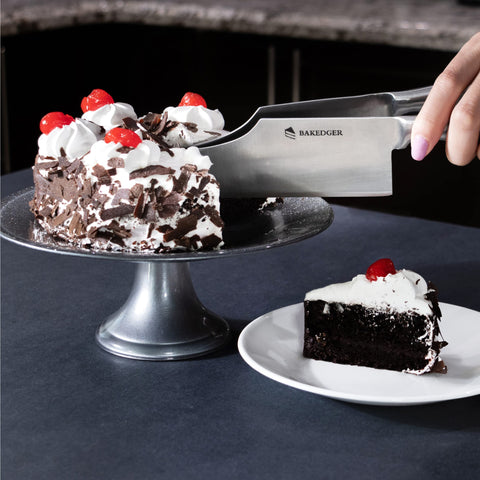 Bakedger serving knife used at a wedding, slicing precisely for flawless portions.