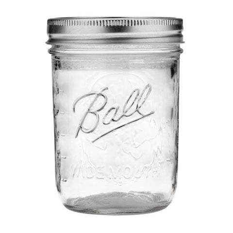 Ball clear glass wide-mouth jar close-up showing sturdy lids and bands for preservation.