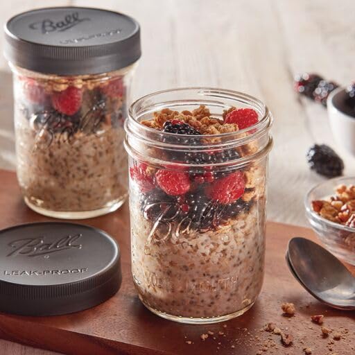 Lids sealing juice and jams on glass jars in a kitchen setup.