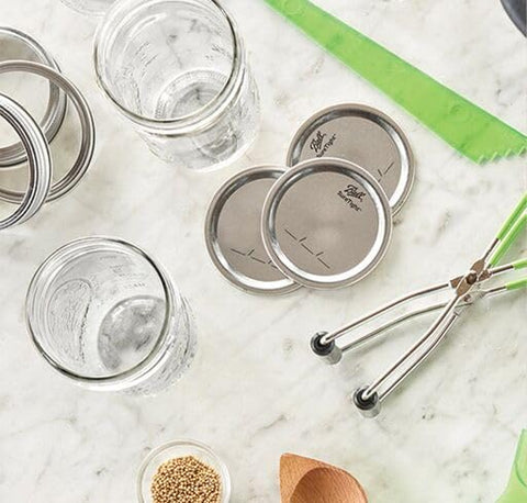 Lids and bands stacked for easy storage by Ball.