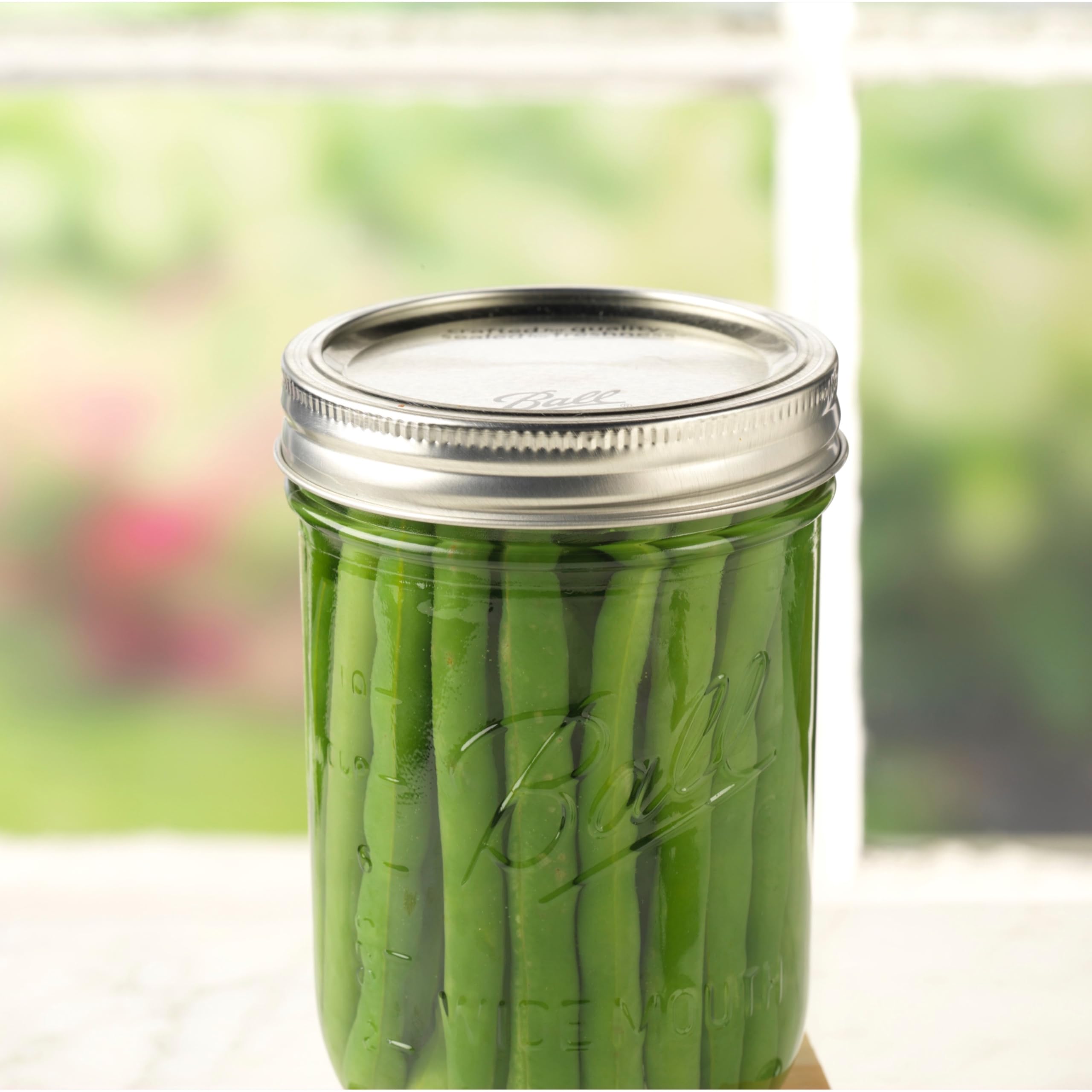 Single-use sealing material detail on Ball canning lids.