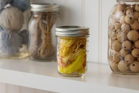 Ball regular-mouth 8oz jars shown in pantry-ready organization.
