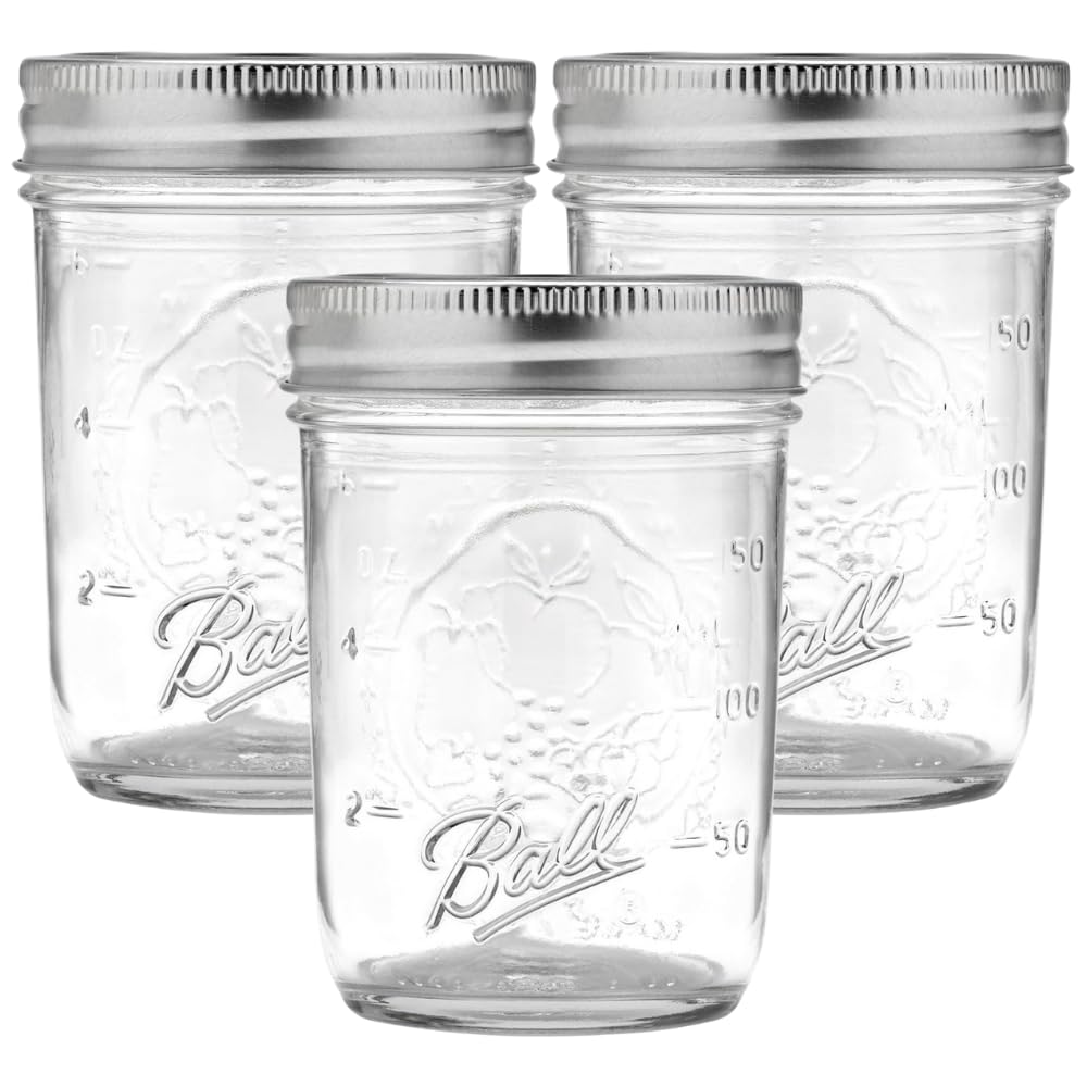 Ball regular mouth 8 oz mason jar front view with lid and band, great for preserves.