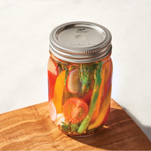 Ball Regular Mouth lid on a glass jar ready for canning