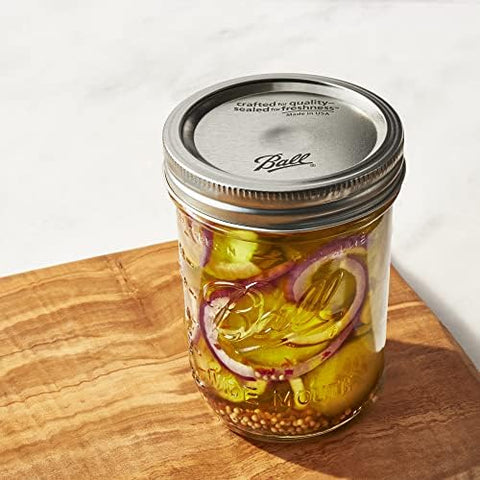 Ball wide-mouth jar labeled for date-stamped storage.