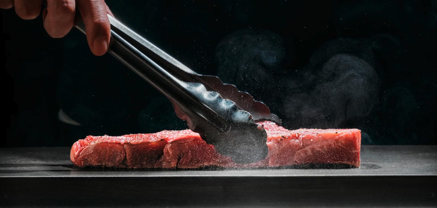 BALMUDA The Teppanyaki okonomiyaki flipping for even browning and dramatic presentation.