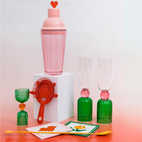ban.do bright pink mid accent, enhances glassware aesthetics.