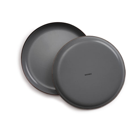Barebones enamel deep plate hand-finished rim bronze patina highlights refined camp dining.