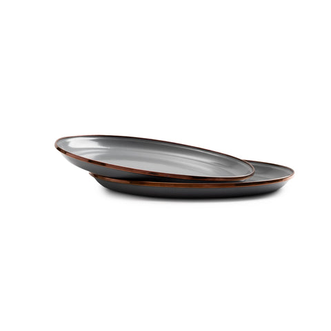 Barebones enamel deep plate raised edges help keep portions neatly contained.