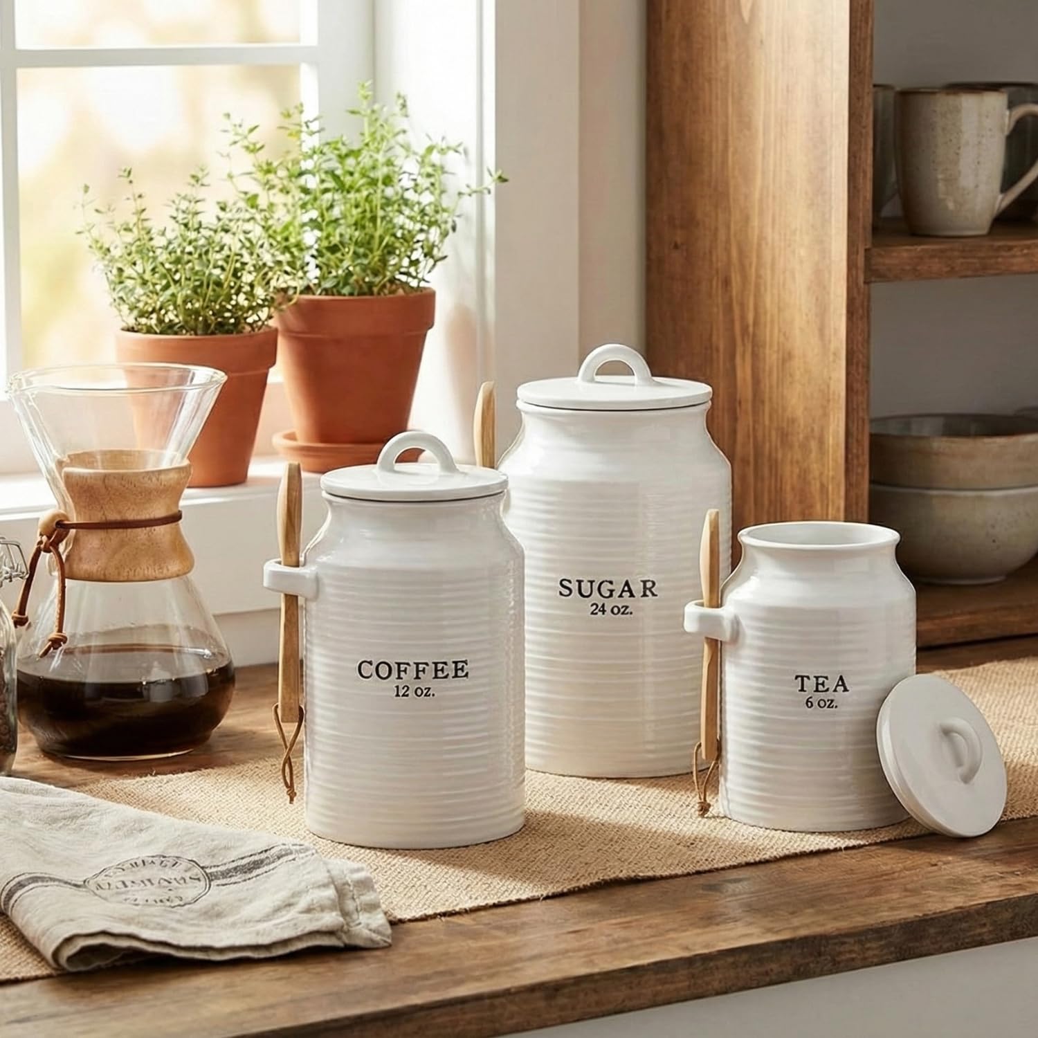 Barnyard Designs sugar canister with lid and wooden spoon for tidy sweetness.