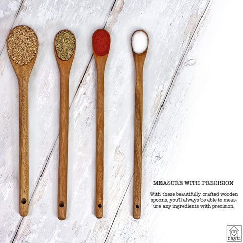 Bayti four-piece wooden measuring spoon set for versatile cooking tasks.