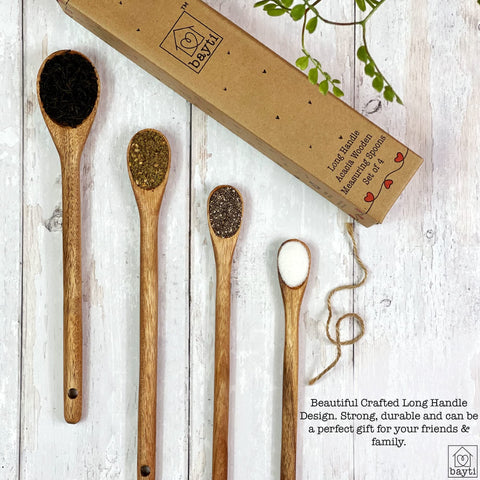 Bayti measuring spoons beside spice jars for accurate seasoning.