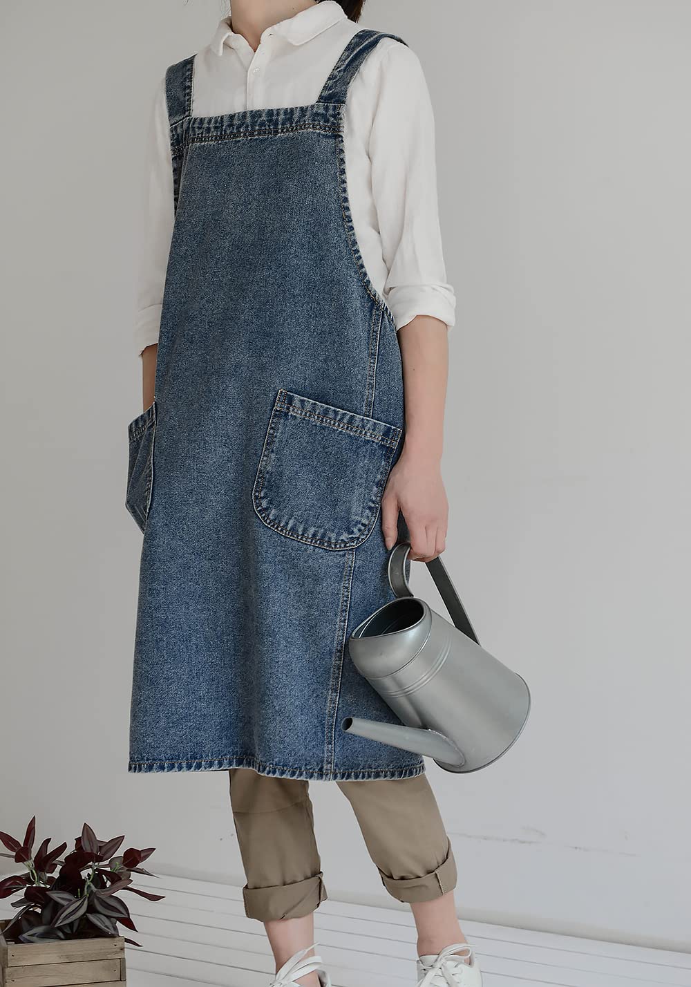 Deep blue BCHWAY FAMILY denim apron color under kitchen lighting.