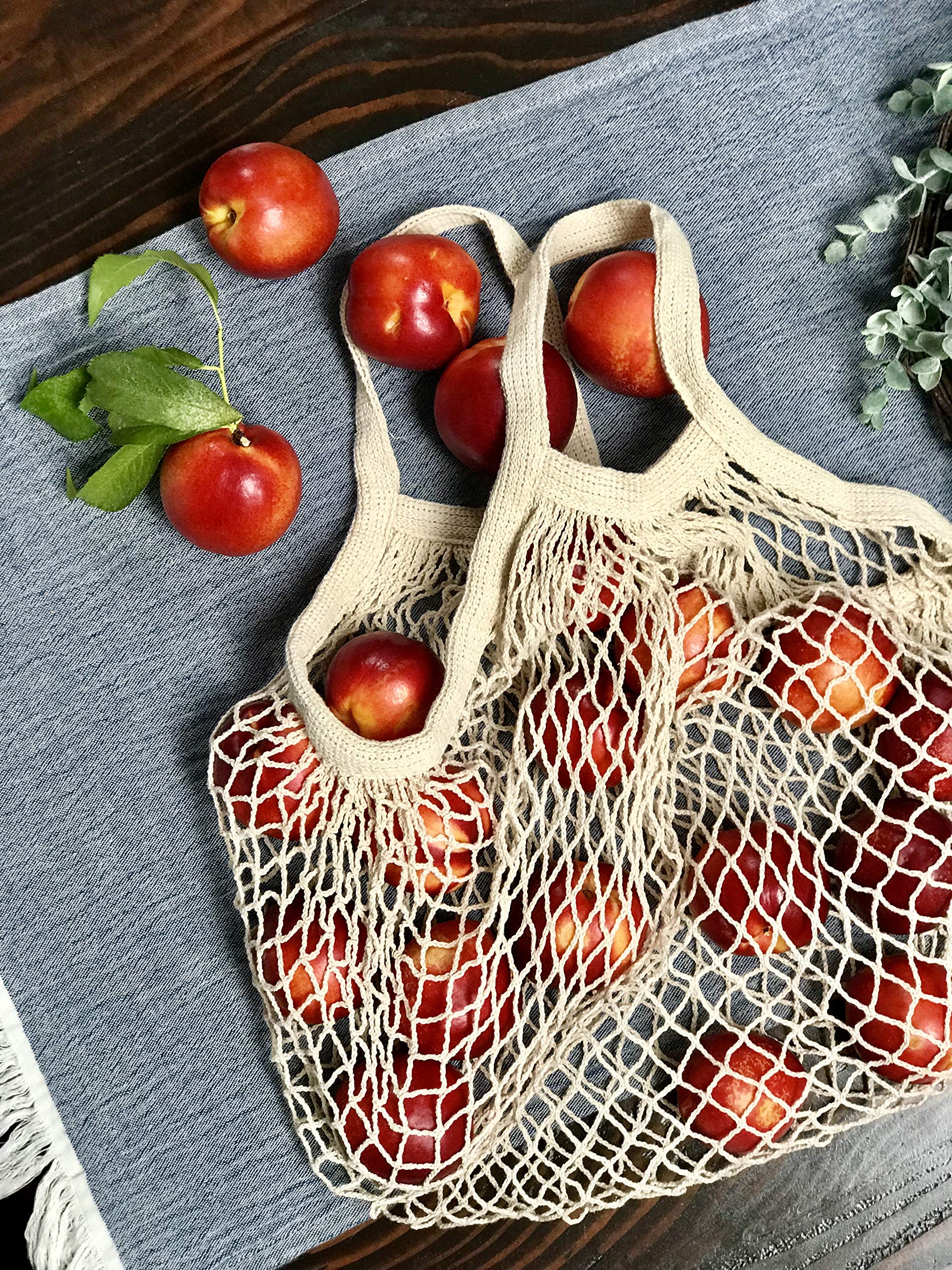 Bee Carefree produce bag with wooden buttons securing groceries.