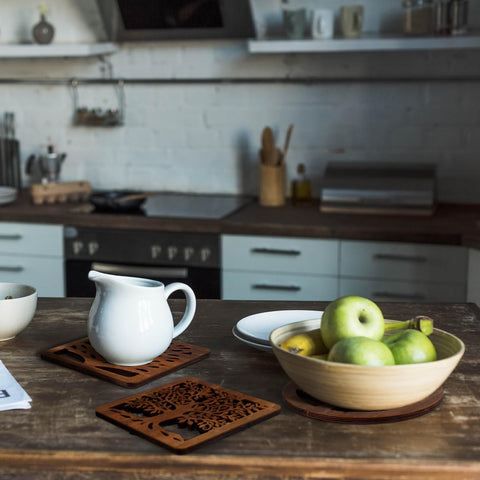 Beeveer heat-resistant wood trivets safeguard surfaces during family meals.