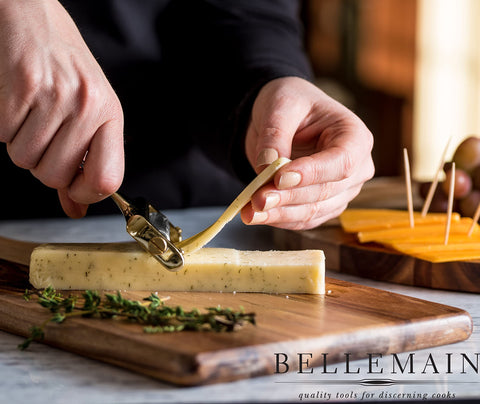Slicer handles cheese blocks up to 3.5 inches wide with easy thickness adjustments.