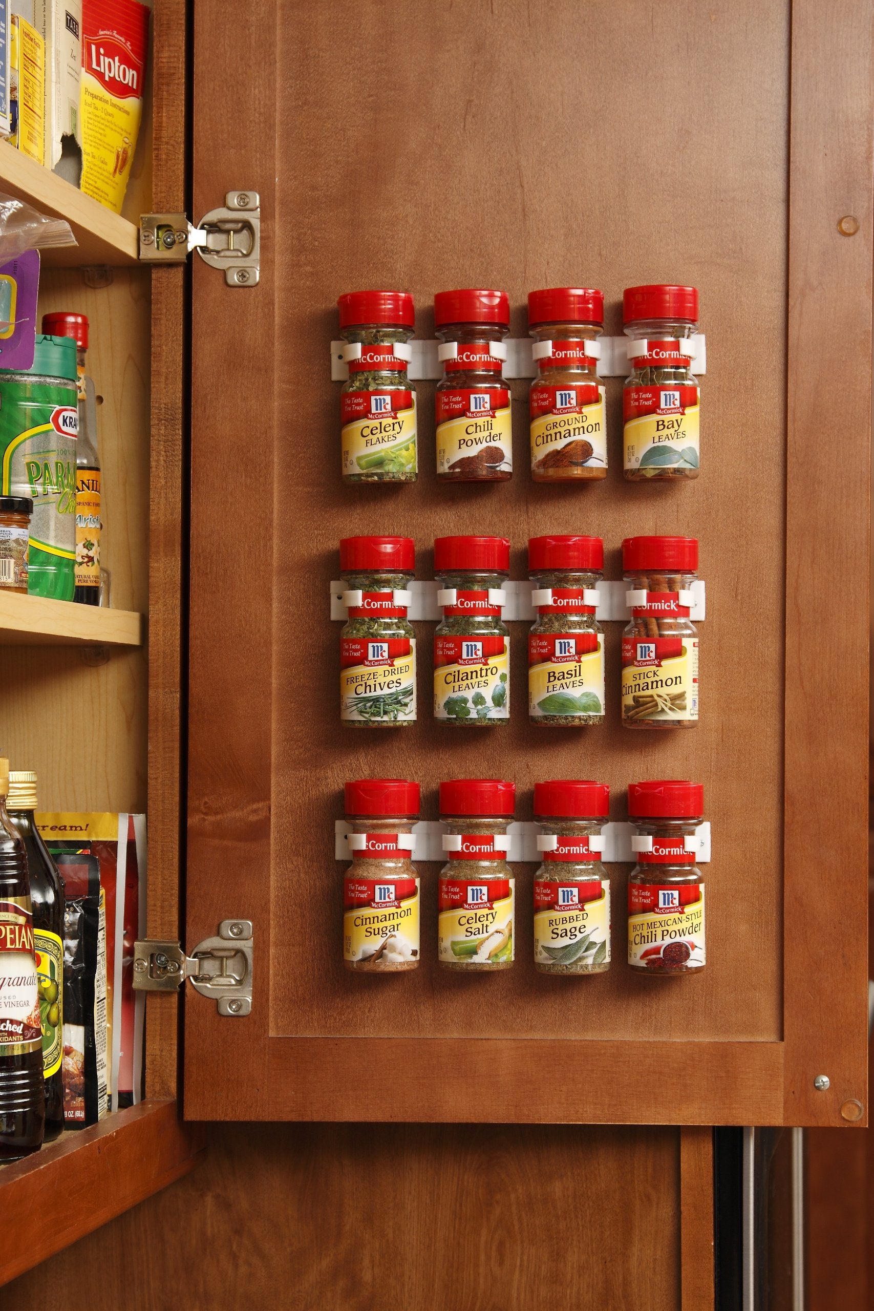 Bellemain spice gripper clip mounted on cabinet for easy access.