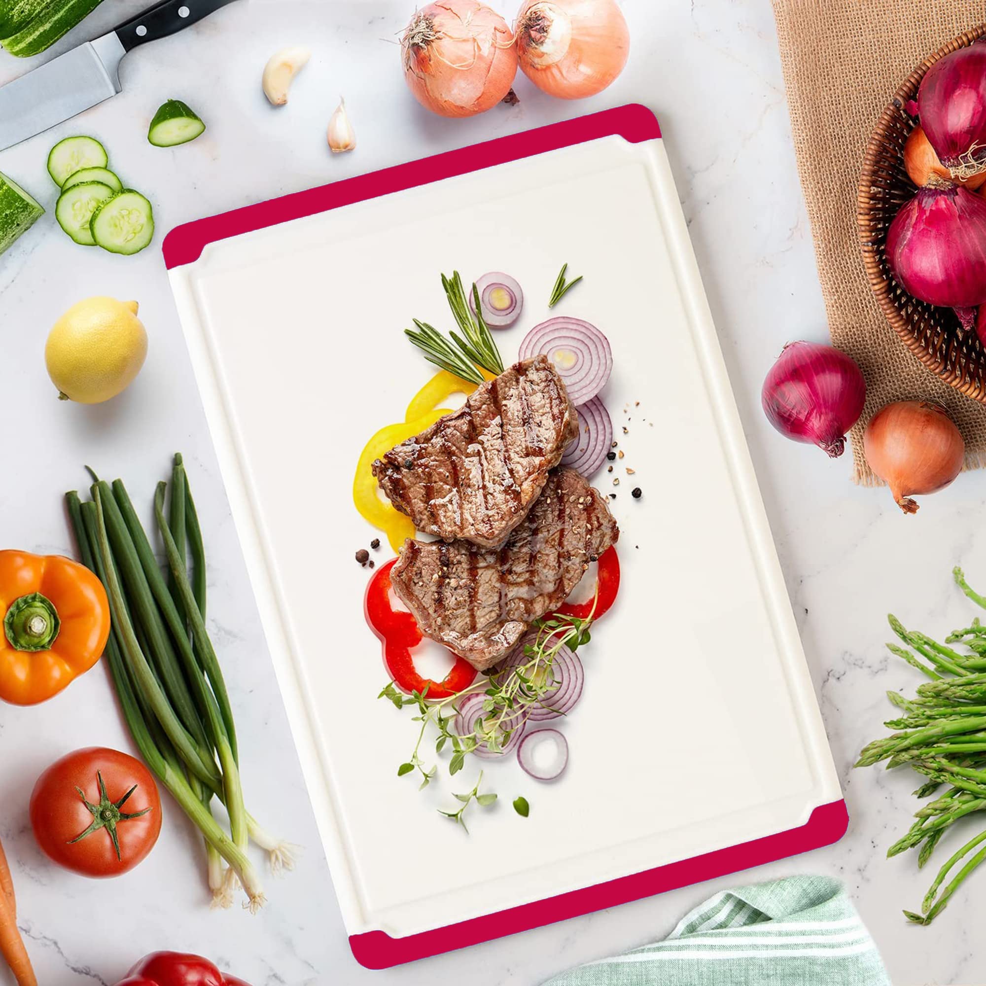 Belwares cutting board red, dishwasher-safe for quick cleanup after cooking.