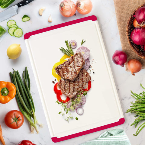 Belwares cutting board red, dishwasher-safe for quick cleanup after cooking.