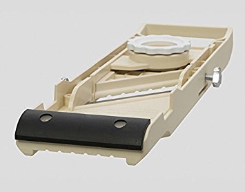Benriner Almond Wide Slicer slicing vegetables for even portions.